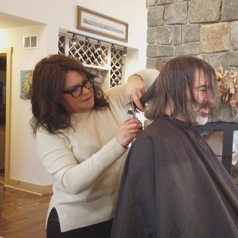 Rachael cutting John's hair