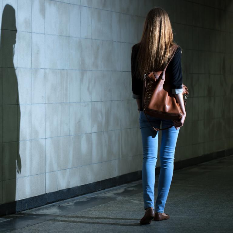 woman walking alone at night